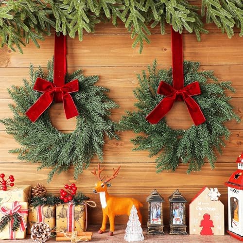 4 Pcs Small Christmas Norfolk Wreaths Evergreen 12.6 Inch Christmas Kitchen Cabinet Mini Wreaths Real Touch with Bow and Burgundy Ribbon for Xmas Front Door Window Home Table Pillar Decor