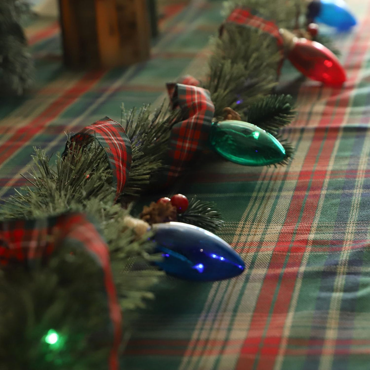 MIYA LIFE Festive Christmas Garland with Red Blue and Green Bulb Lights - 6.5FT Norfolk Pine Branch on Red Bow 25 LED
