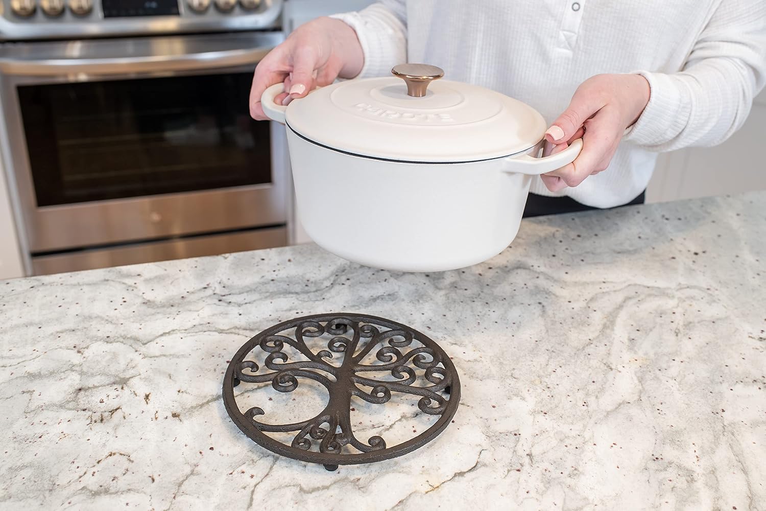 GASARÉ, Cast Iron Trivet for Hot Dishes, Pots, and Pans, Metal Trivet, Tree of Life Design, Rubber Feet Caps, Ring