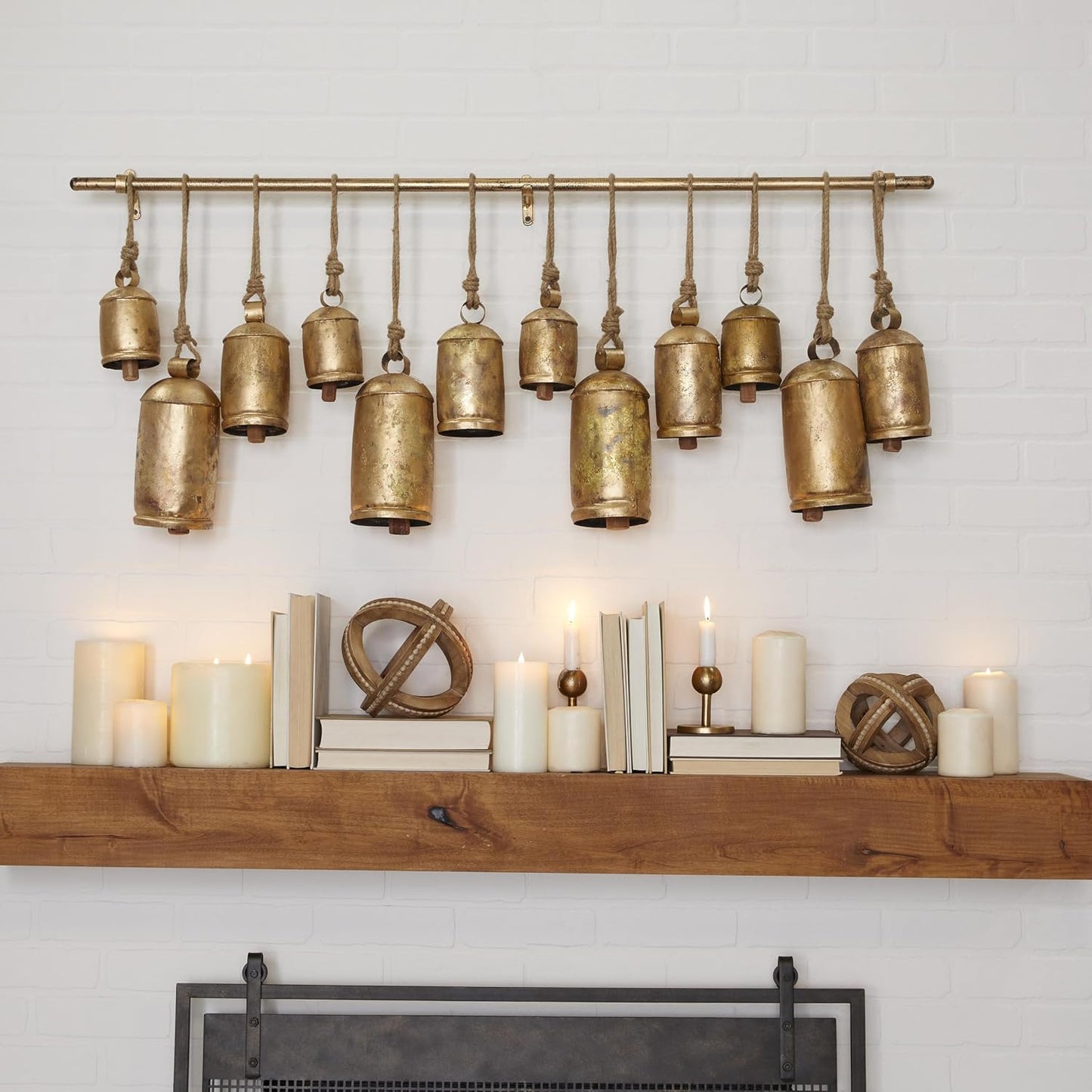Deco 79 Metal Decorative Cow Bells Tibetan Inspired with 12 Bells on Jute Hanging Ropes and Rod, 48" x 6" x 20", Gold