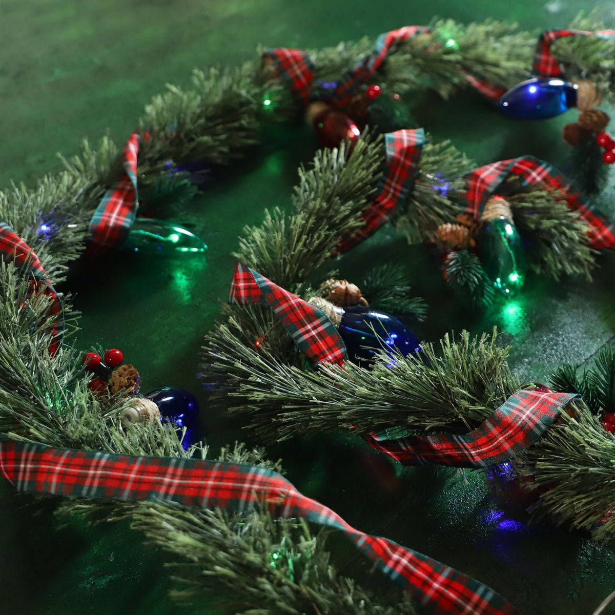 MIYA LIFE Festive Christmas Garland with Red Blue and Green Bulb Lights - 6.5FT Norfolk Pine Branch on Red Bow 25 LED