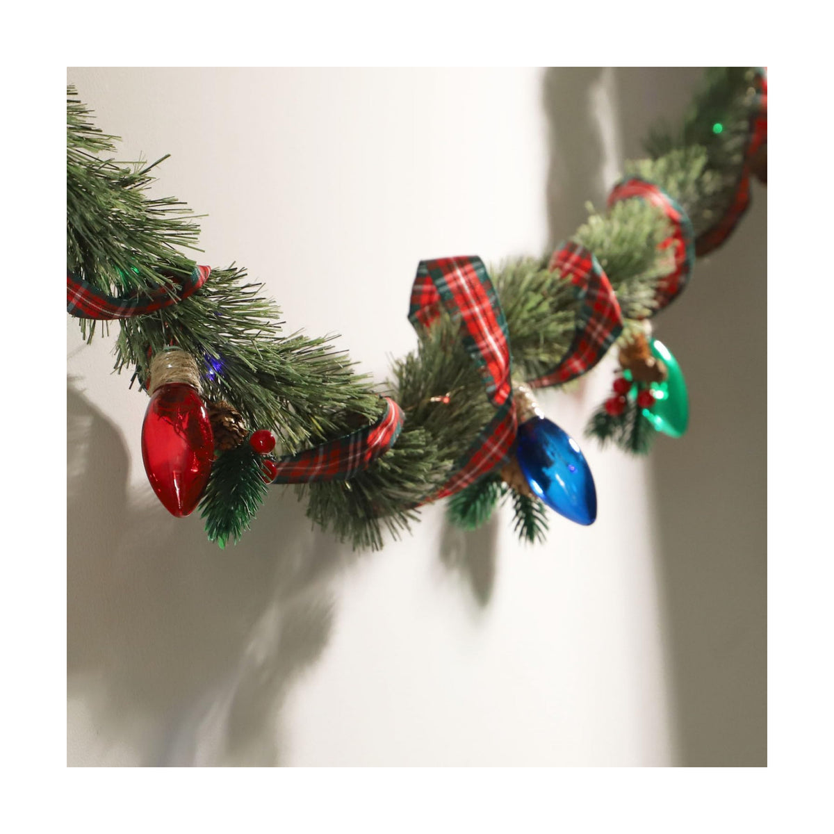 MIYA LIFE Festive Christmas Garland with Red Blue and Green Bulb Lights - 6.5FT Norfolk Pine Branch on Red Bow 25 LED